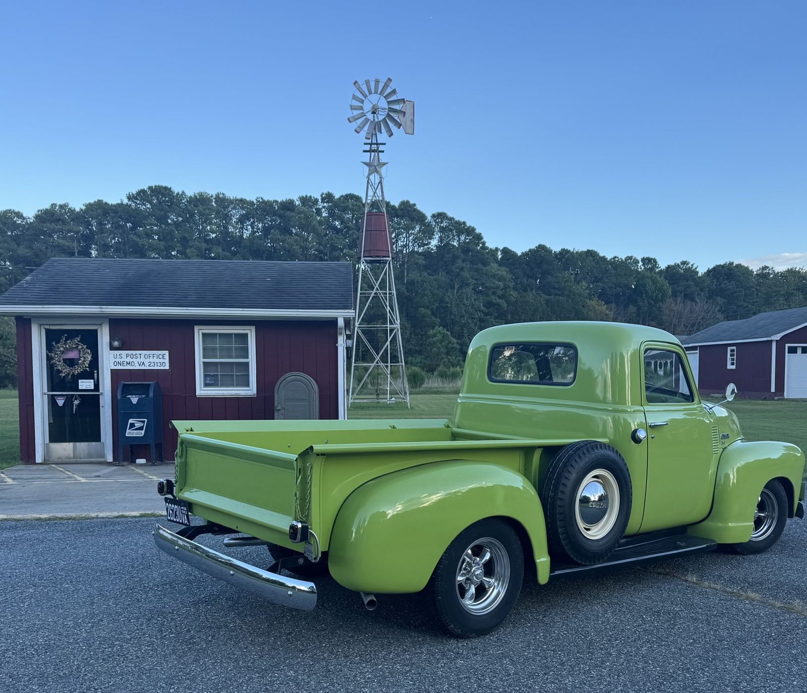 Green 1950 Chevrolet 3600 from the rear three-quarter in Middlesex County